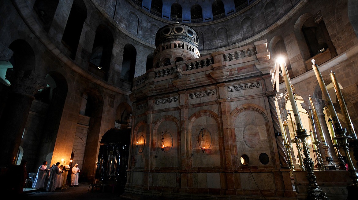 Members of a non-English speaking religious society gather for a candle-light ceremony before dawn at the Coptic Chapel and the Tomb of Christ on Feb. 22, in the Church of the Holy Sepulchre in Jerusalem. (Brenda Ahearn photos/Daily Inter Lake)