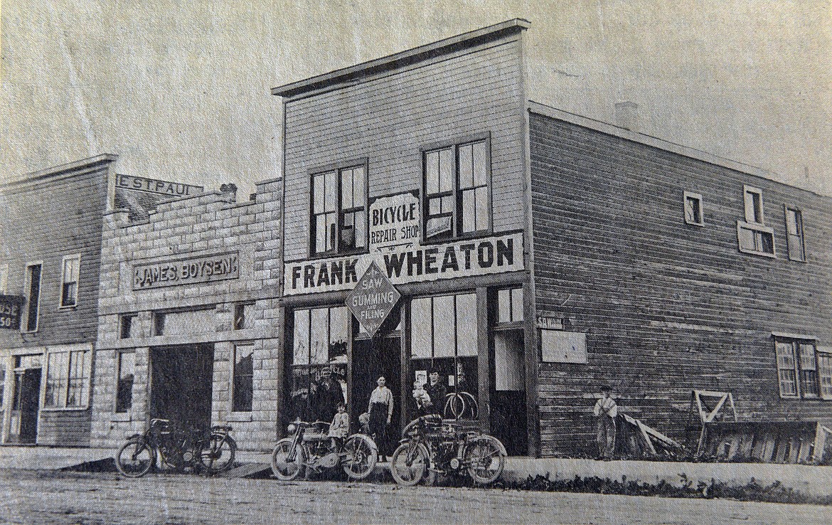 A young Frank Wheaton posed with his wife and little children in front of his store on First Avenue West in Kalispell. (Photo provided)