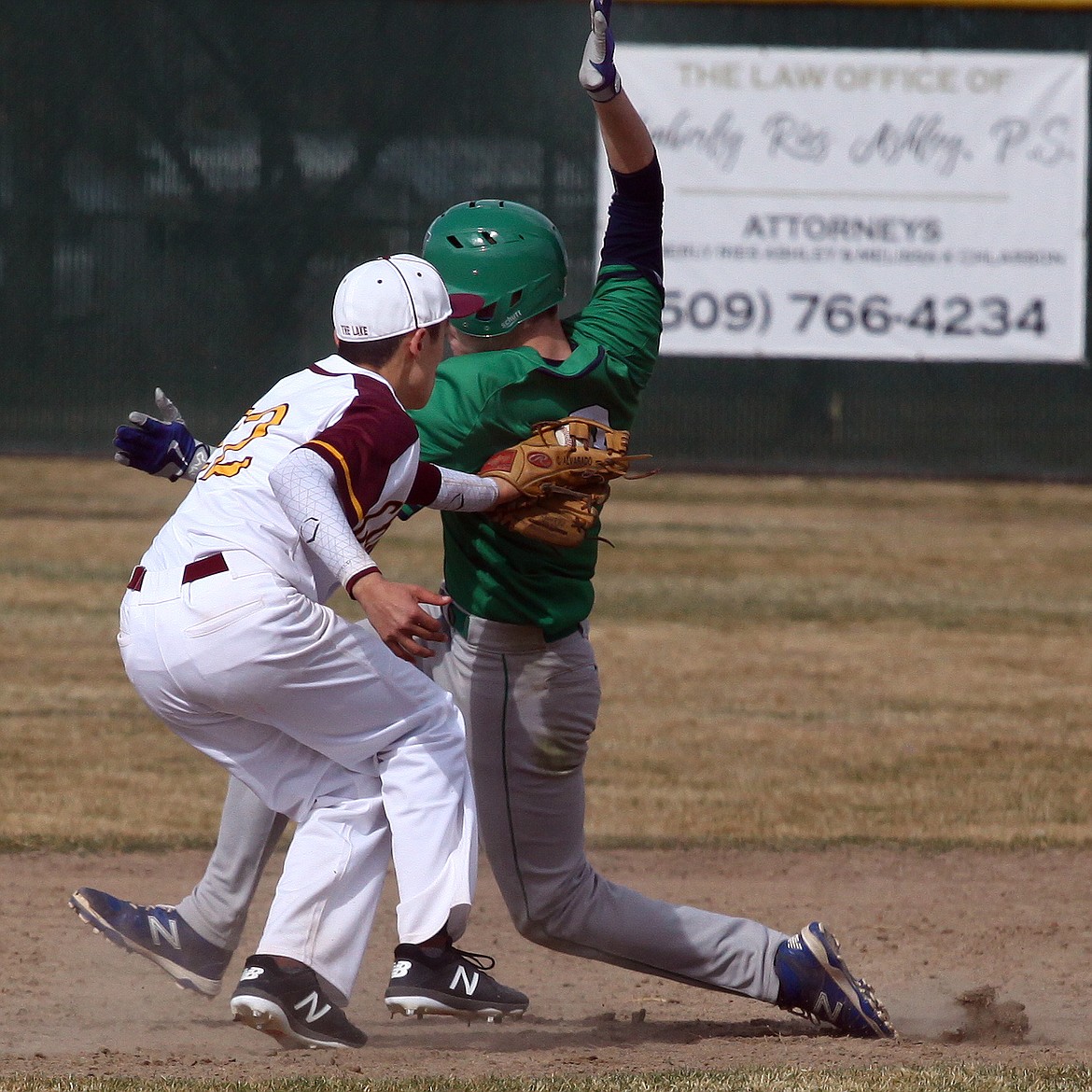 Rodney Harwood/Columbia Basin Herald
Moses Lake shortstop Cody Alvarado (22) tags out Woodinville runner Andrew Hastie (3) trying to steal second base during Saturday's non-league game at Larson Playfield.