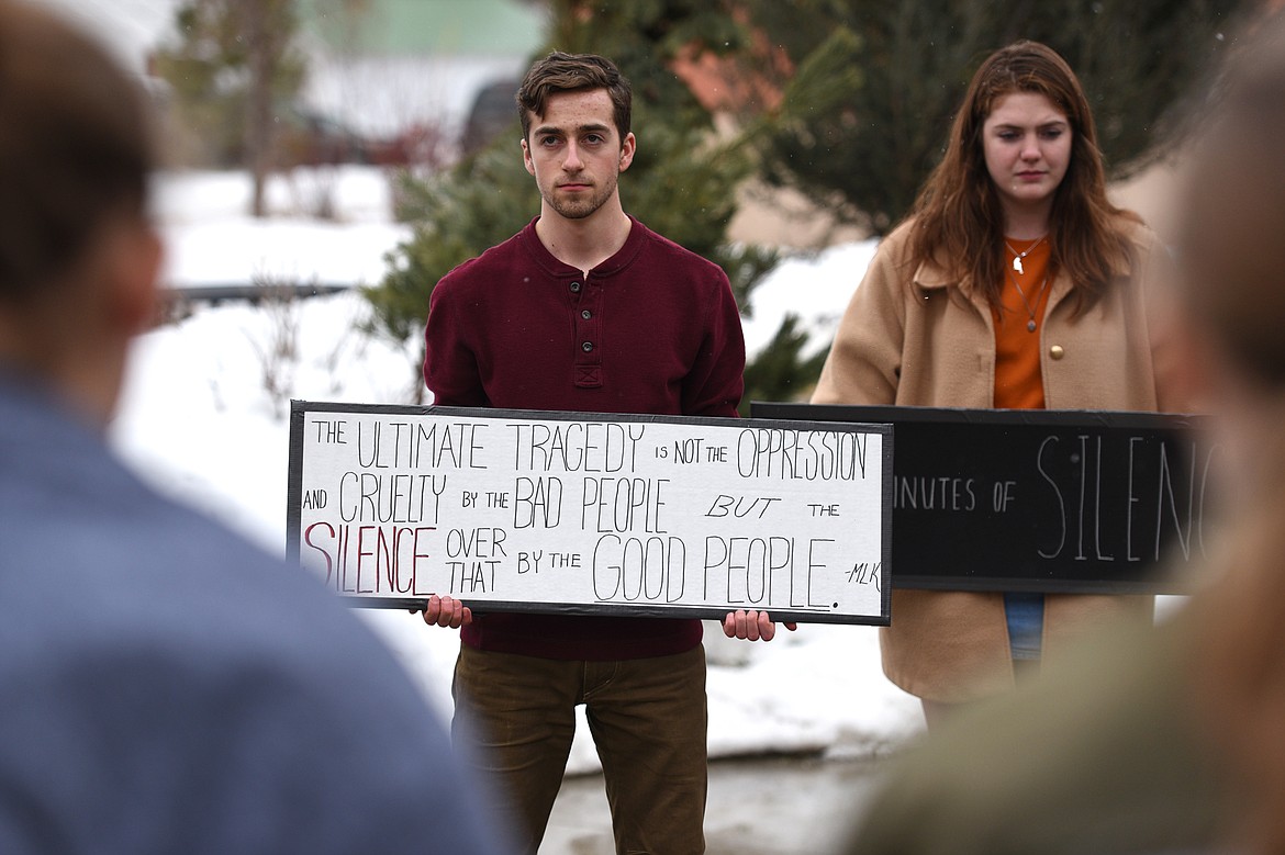 Flathead High School students participate in the student-planned &quot;17 Minutes of Silence Memorial&quot; Wednesday afternoon to mark one month since a mass shooting left 17 dead at Marjory Stoneman Douglas High School in Parkland, Fla. (Casey Kreider/Daily Inter Lake)