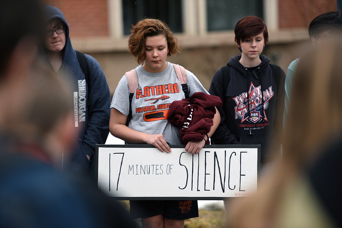 Flathead High School students participate in the student-planned &quot;17 Minutes of Silence Memorial&quot; Wednesday afternoon to mark one month since a mass shooting left 17 dead at Marjory Stoneman Douglas High School in Parkland, Fla. (Casey Kreider/Daily Inter Lake)