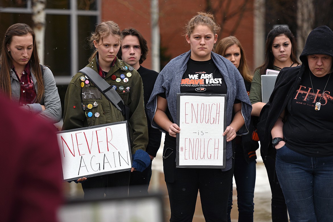 Flathead High School students participate in the student-planned &quot;17 Minutes of Silence Memorial&quot; Wednesday afternoon to mark one month since a mass shooting left 17 dead at Marjory Stoneman Douglas High School in Parkland, Fla. (Casey Kreider/Daily Inter Lake)