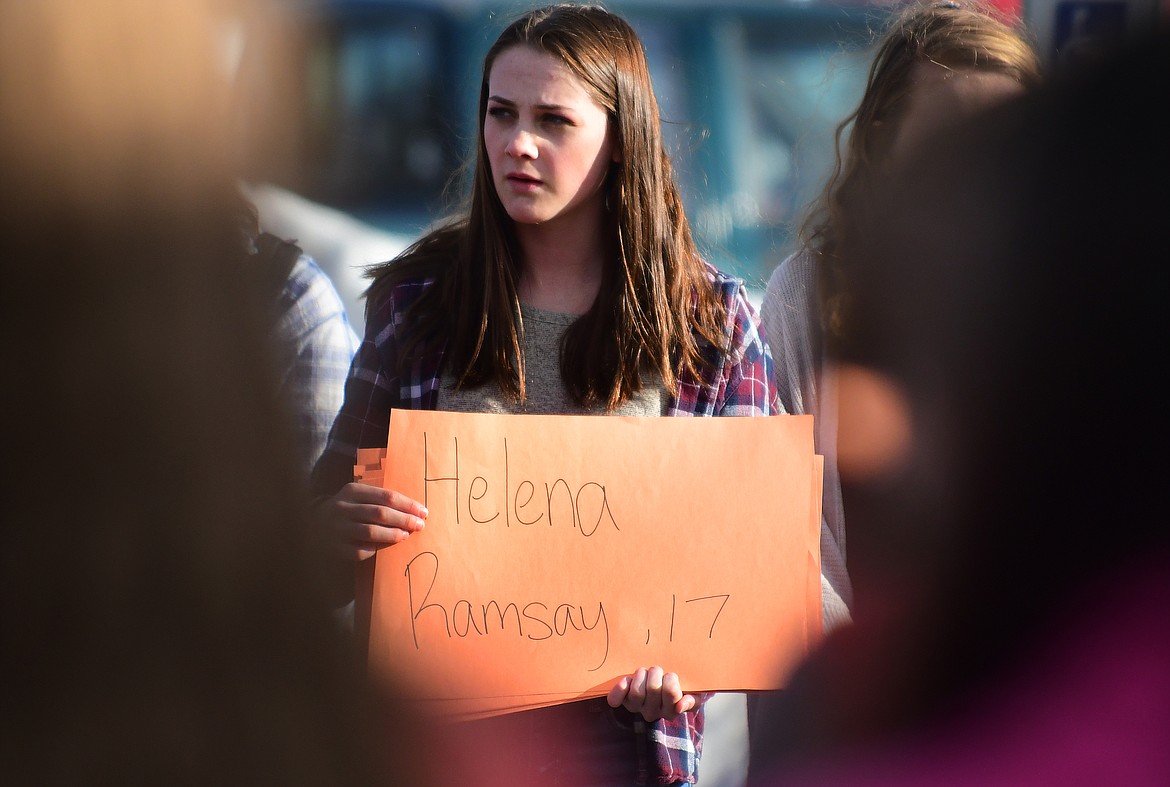 Each victim of the Marjory Stoneman Douglas High School shooting was memorialized in front of Columbia Falls High School Wednesday. The name and age of each person who was killed in the shooting was read, each followed by a minute of silence. (Jeremy Weber/Hungry Horse News)