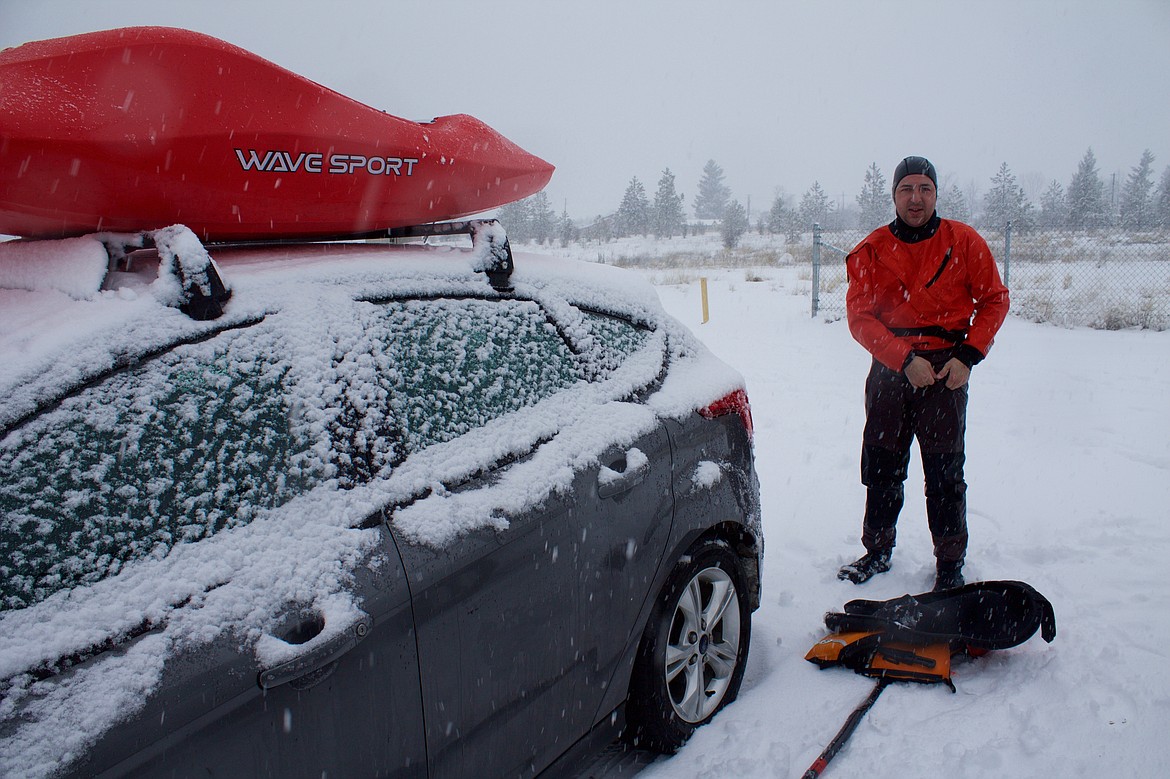 Drew Stephens returns to his car after a morning of kayaking.