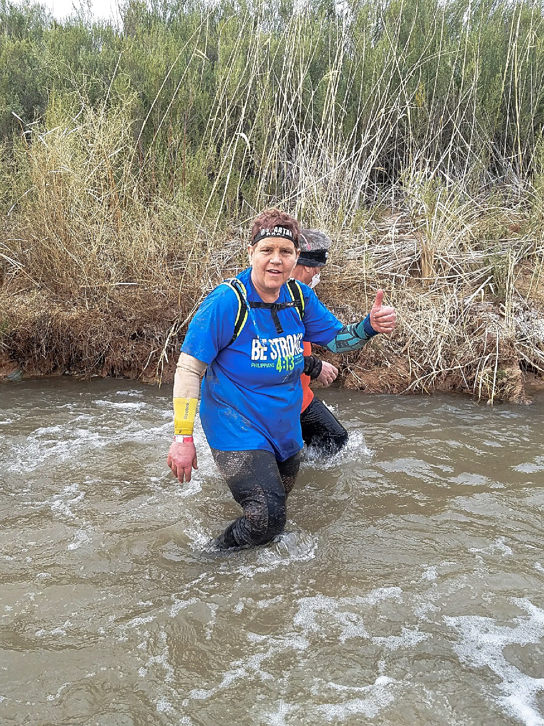 Roxanna Escuerdo wades through water on the 8.4 mile the Spartan Super course in Las Vegas. (Courtesy photo)