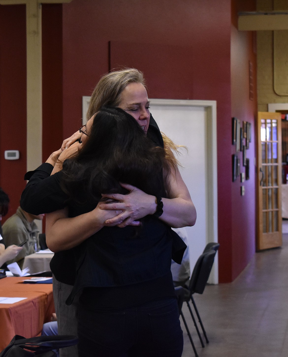 Marilyn Delgado, front, receives a big hug from transwoman Jenny Seibert during the Human Rights Education Institute&#146;s inaugural Human Library event Saturday. The two shared a deep connection after Delgado shared with Seibert that her son had just come out as transgender and that she wants to be as loving and supportive as possible. &#147;She&#146;s saving her son&#146;s life,&#148; Seibert said.

ANNA-LEE BOERNER/Special to The Press