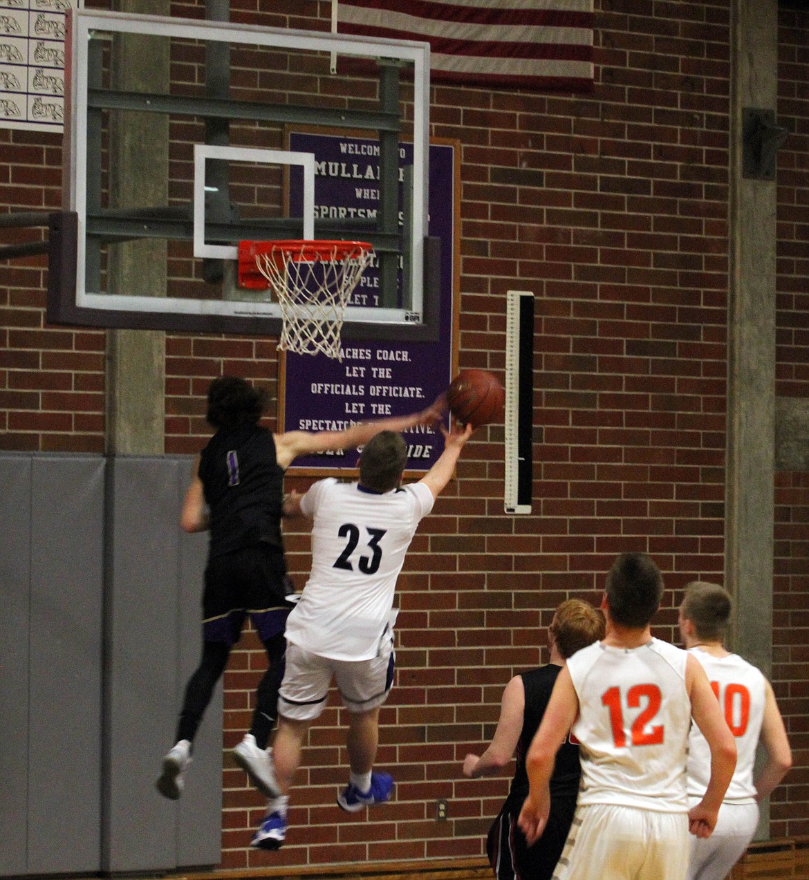 Wildcat Tyler Gibbons gets the chase down block over friend and Coeur d&#146;Alene High School player Caleb Beggerly.

Photo by Josh McDonald