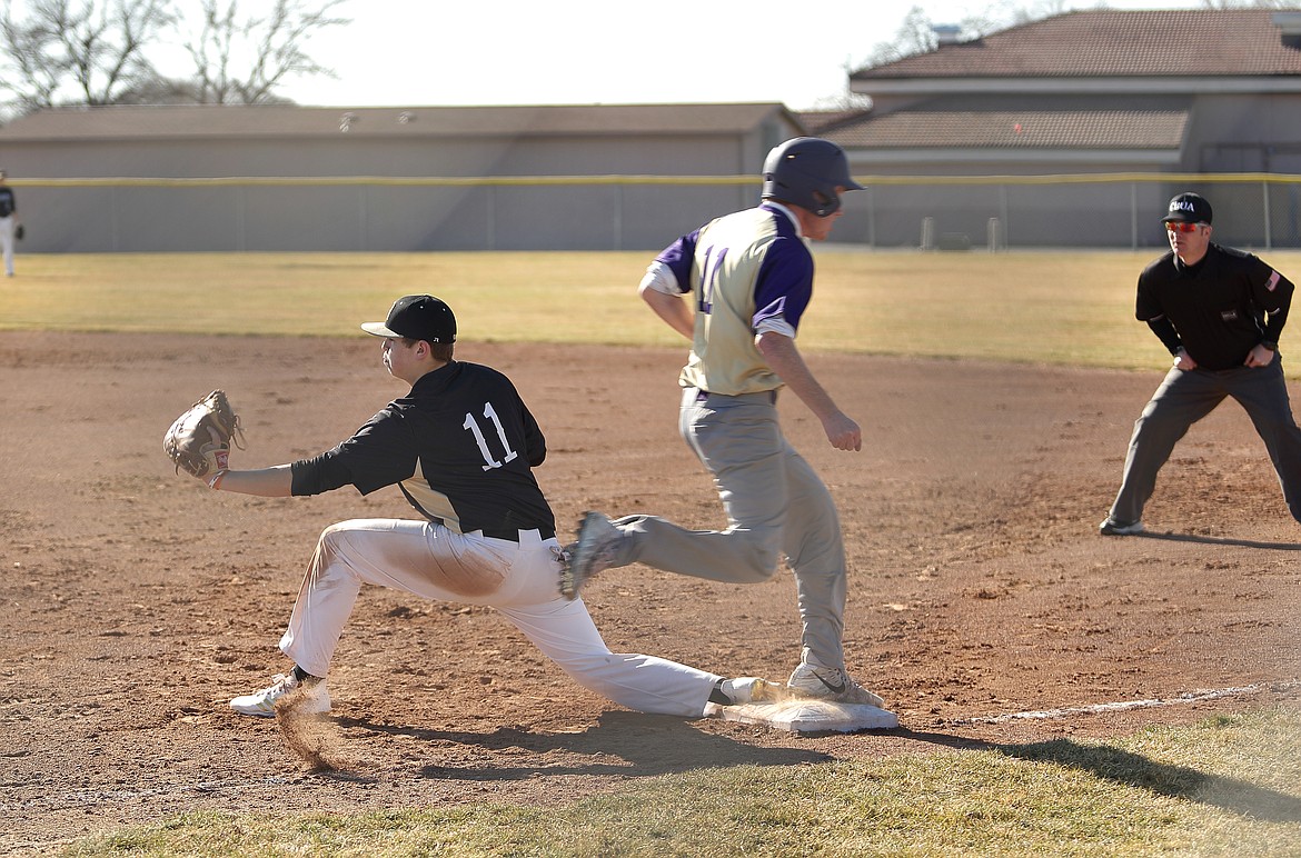 Dorsing Designs Photography/courtesy photo - JC Worsham tags a player out a first during Royal's doubleheader against Goldendale Saturday.