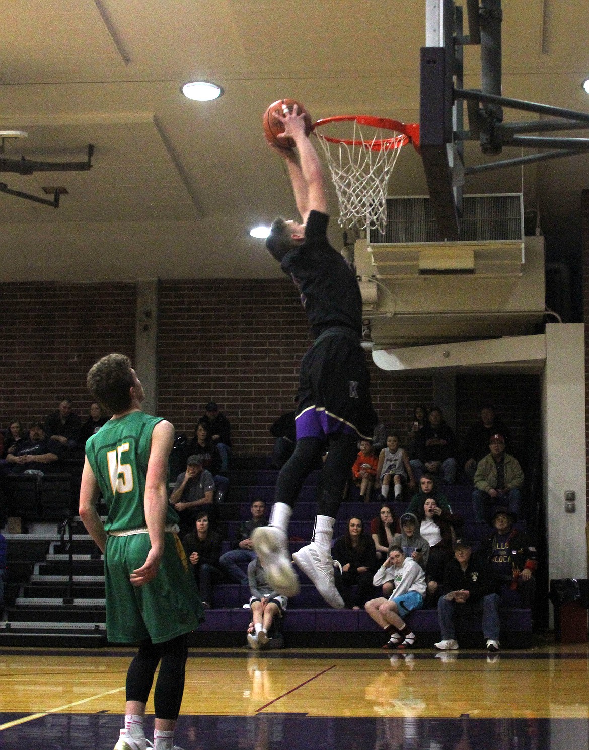 Kellogg&#146;s Tanner Mueller gets some help from Lakeland&#146;s Caden Davis during the slam dunk competition at the 2018 District I All-Star Game. Mueller finished in second place in the competition. 
Photo by AriAna McDonald