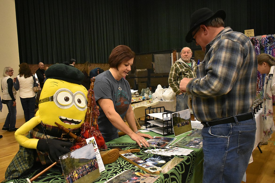 Dee Teske talks with Bubba Leggins about the Kootenai Highland Gathering Celtic Games during the 23rd annual Libby Irish Fair March 10. (Ben Kibbey/The Western News)
