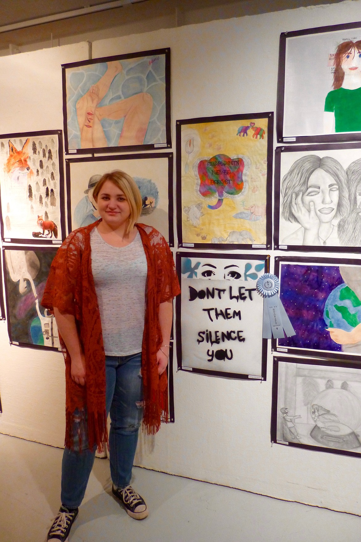 Sydney Macoisek with her piece, &#147;Who&#146;s Your &#145;Them&#146;?&#148; that received an honorable mention.
