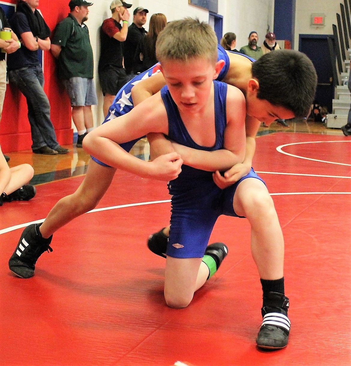 In Novice, 65 pound, Gannon Quinlan (front) placed second and Tristan Avila (back) placed third. Cat Phineas Cataldo placed first and Brydon Drey fifth during Little Guy Wrestling in Superior on Saturday. (Kathleen Woodford/Mineral Independent)