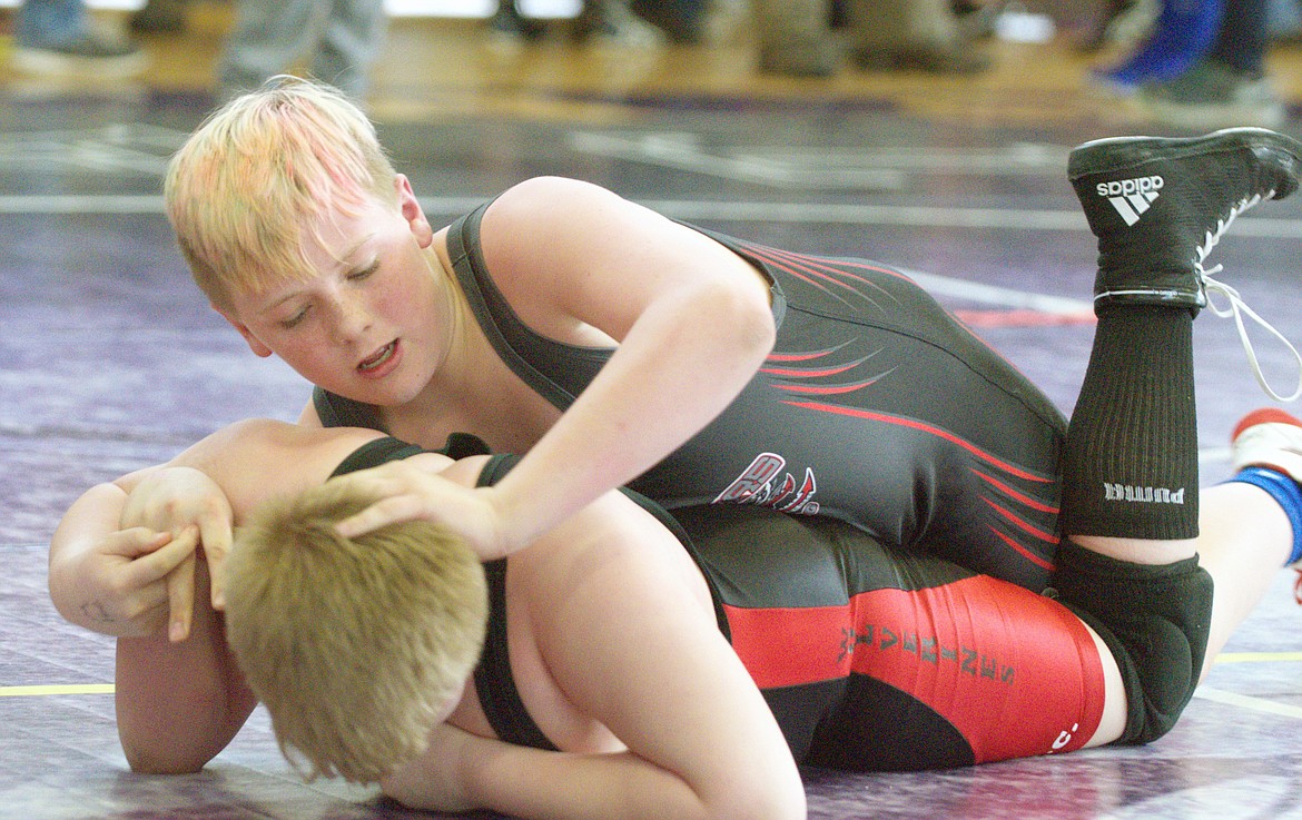 ARLEE LITTLE guy wrestler Jacob Knoll attempts to pin his opponent at the Unit-2 qualifier Saturday afternoon at Polson High School. (Jason Blasco/Lake County Leader)