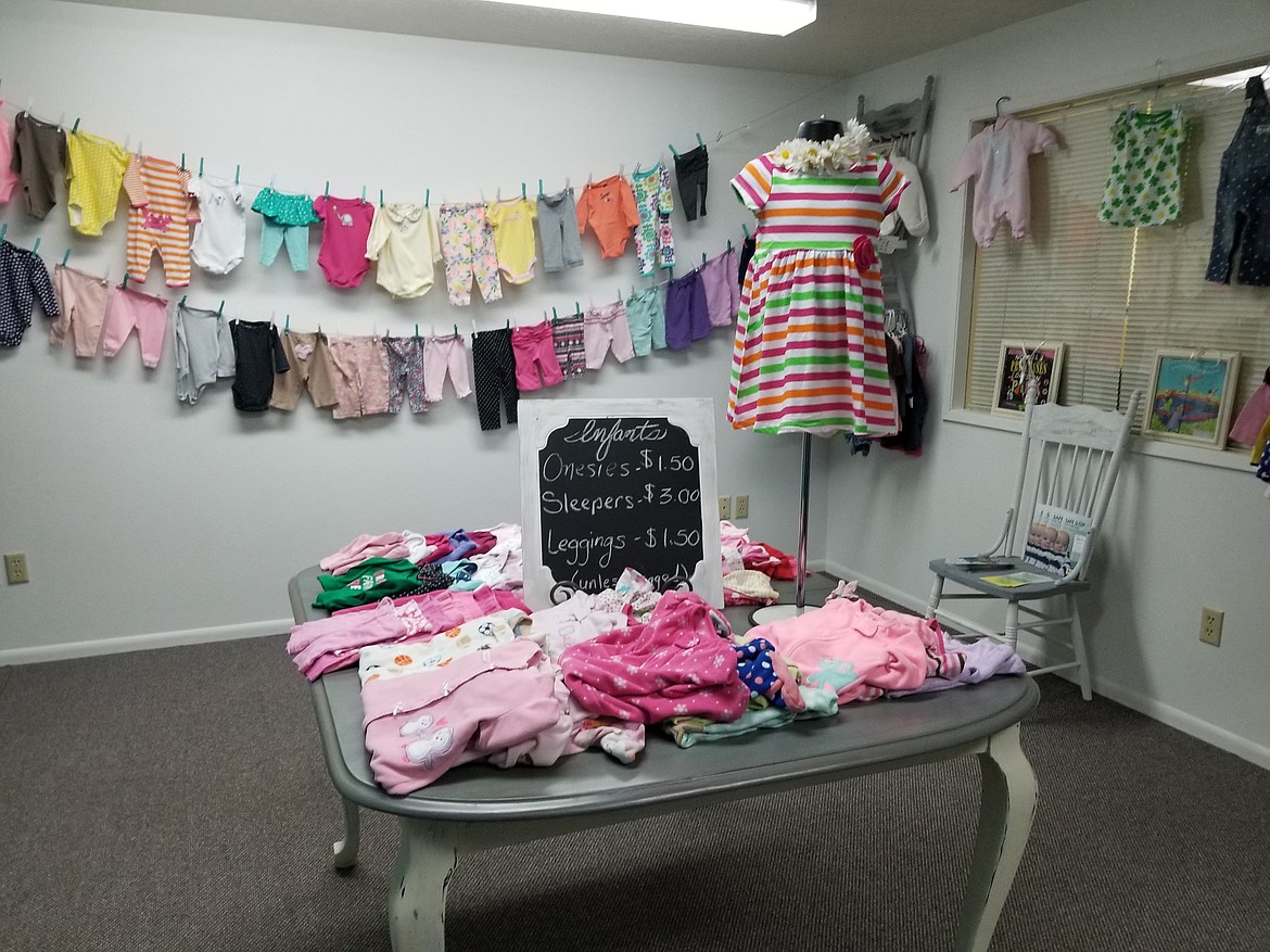 Photo by Mandi Bateman
Downstairs in the Clover &amp; Co. showcases a wide array of childrens clothing.