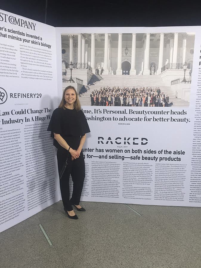 FORMER CHARLO resident Crystal Kain stands in front of press coverage from the company she works for, Beautycounter. (Photo provided)