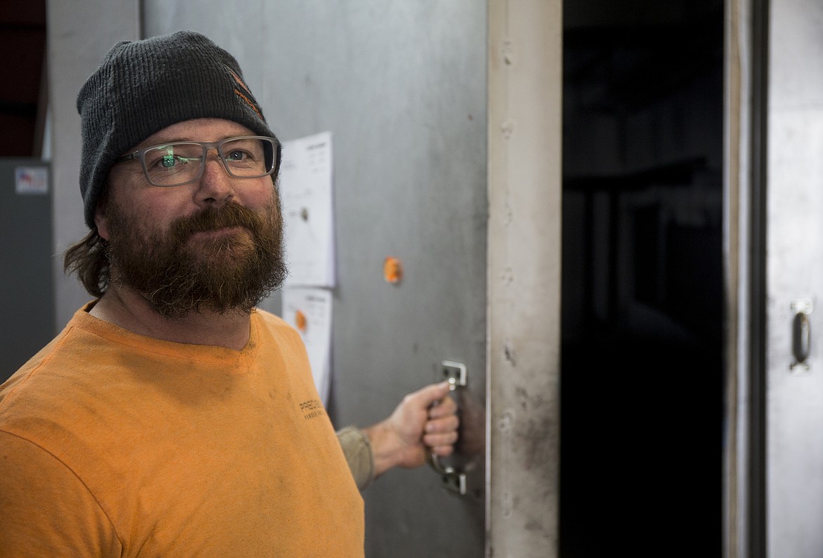 Photos by LOREN BENOIT/NIBJ
Powder coating business owner Wade Gagnier opens a large steel oven as he poses for a portrait in Rathdrum. His business just started in early November in a 7,200-square-foot facility where they blast, finish and coat steel products and more.