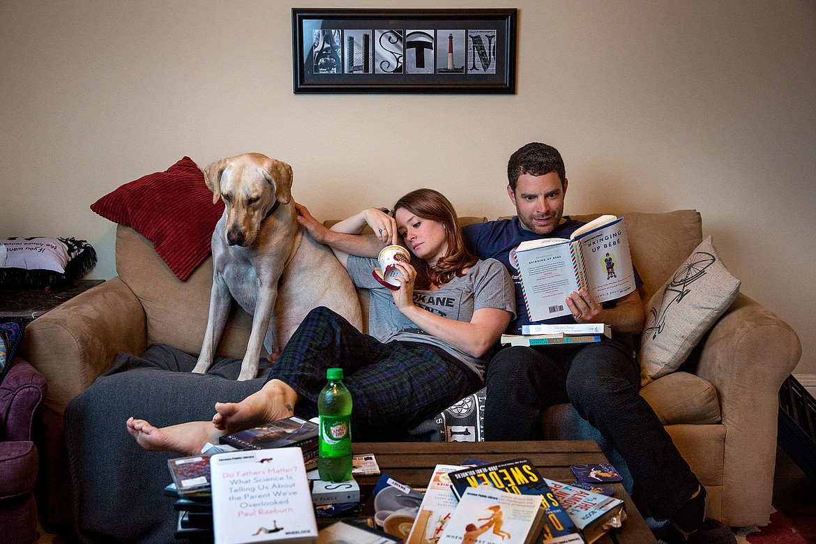 Photo by JEROME POLLOS PHOTOGRAPHY
Kaarin and Andrew Austin went for a different approach to announce the expansion of their family with some subtle clues and a typical pregnancy night for them Thursday, Aug. 4, 2016, at their home in Tacoma, Wash.