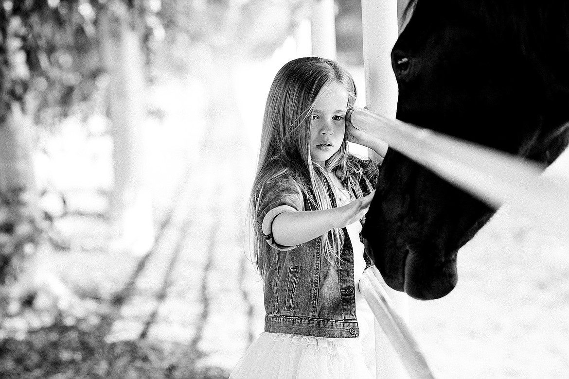 Photo by JEROME POLLOS PHOTOGRAPHY
Maddy Capps, 4, visits with a horse at the Annadale Equine Center in Sanger, Calif., on Saturday, April 22, 2017.