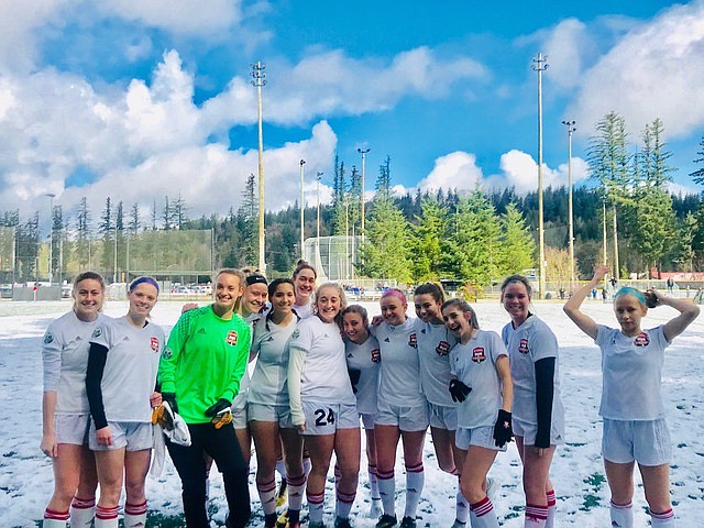 Courtesy photo
The Sting Timbers 00/01 girls soccer team dashed through a snowy field in Renton, Wash., on their way to the semifinals of the Washington Cup. From left are Eryn Ducote, Tiana Cydell, Lily Foster,  Elizabeth Lehosit, Courtney Cydell, Bridget Rieken, Julieanna Stith, Addie Smart, Chloe Teets, Lexi Medina, Maddie Smith, Jordan Roth and Erika Skindlov. Not pictured are coach Julio Morales and fitness trainer Frank Morton.