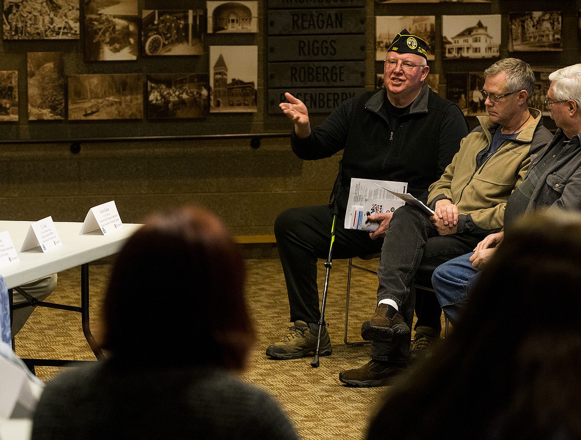 Hayden resident and 20 year Army veteran Dennis Sinning asks VA officials about medical claims during a veterans town hall Tuesday evening at the Coeur d'Alene Library. (LOREN BENOIT/Press)