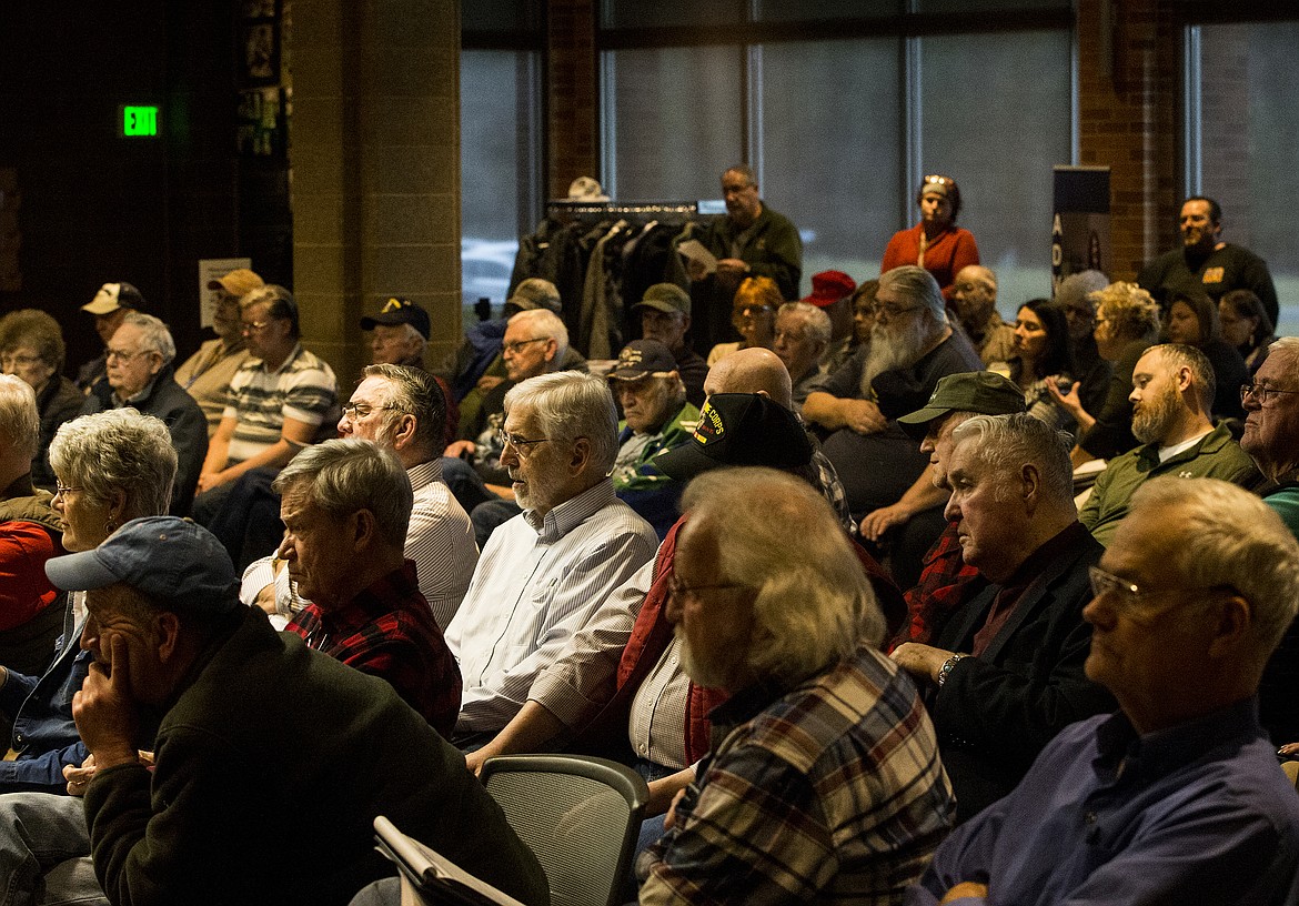 Local veterans listen in as both employees from the Mann-Grandstaff VA Medical Center in Spokane and the North Idaho VA clinic in Coeur d&#146;Alene answer questions during a veterans town hall Tuesday evening at the Coeur d'Alene Library. (LOREN BENOIT/Press)