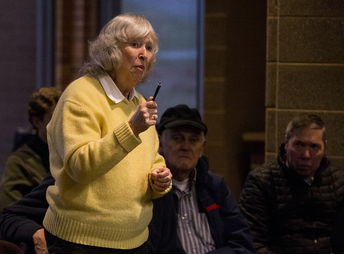 Mignon MacElvaney, a wife of a Navy veteran, thanks employees and officials of the Mann-Grandstaff VA Medical Center for their veteran care during a veteran town hall Tuesday evening at the Coeur d'Alene Library. (LOREN BENOIT/Press)