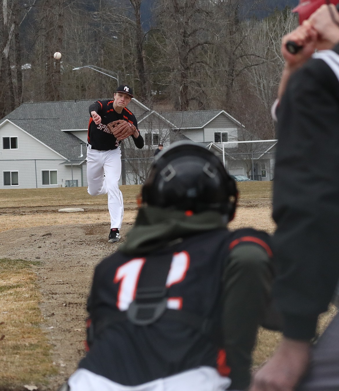 (Photo by ERIC PLUMMER)
Cole Thompson fires a pitch in the Spartans&#146; season opening loss to Sandpoint last week.