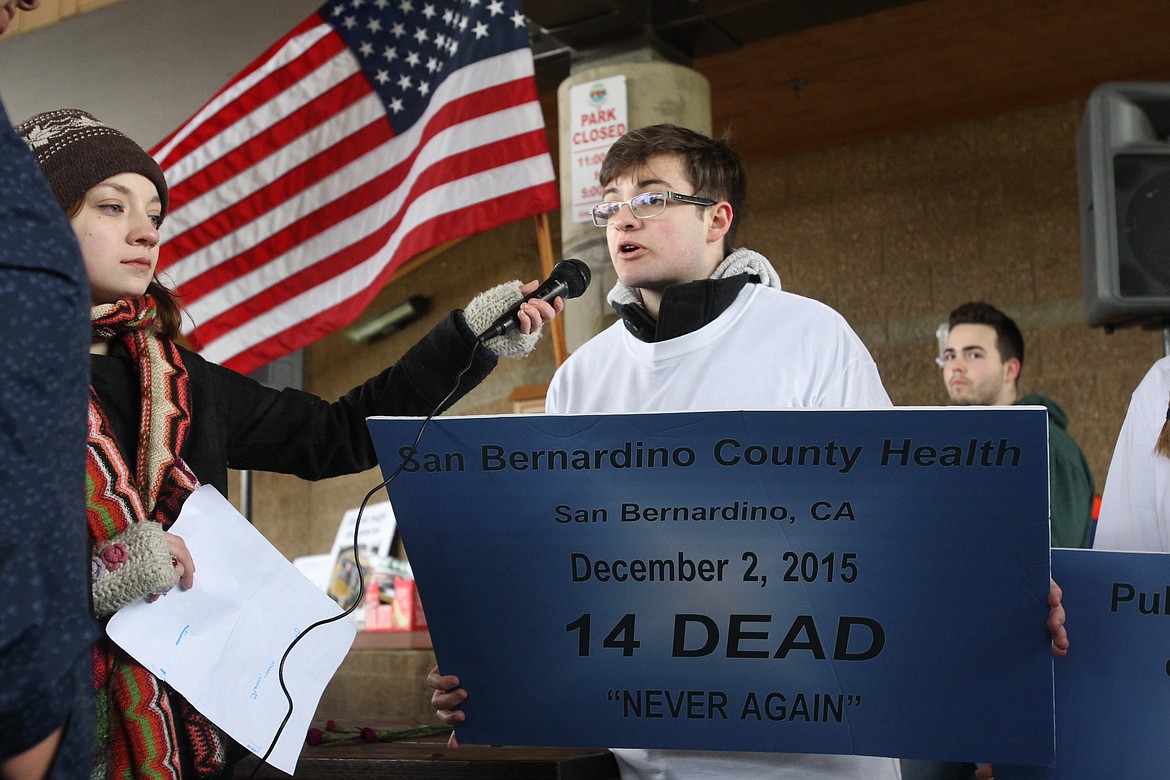 &#147;San Bernardino County Health, San Bernardino, Calif. Dec., 2, 2015. 14 dead. Never again,&#148; Coeur d&#146;Alene High School junior Seth Romeo speaks into the microphone, held by somber Lake City High School sophomore Zo&euml; O&#146;Brien, during the March for Our Lives in McEuen Park on Saturday morning. 

DEVIN WEEKS/Press