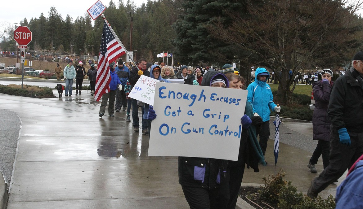 A sea of people winds along the Centennial Trail from McEuen Park to Independence Point during the March for Our Lives in downtown Coeur d'Alene on Saturday. Many expressed their opinion about gun control, school shootings, supporting students and more during this &quot;sibling&quot; march that took place in conjunction with about 850 others around the world. The movement was started by surviving students of the Feb. 14, 2018 Parkland, Fla. shooting. (DEVIN WEEKS/Press)