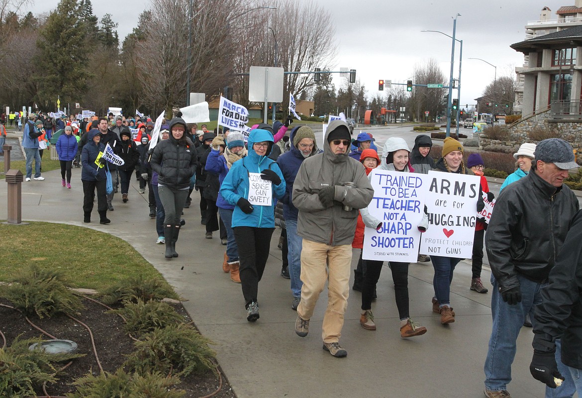 At least 450 people of all ages attended the March for Our Lives in downtown Coeur d'Alene despite 30-degree weather and icy cutting winds on Saturday. The crowd met in the McEuen Park pavilion to listen to speakers and share heartfelt moments before winding along the path to Independence Point and back. (DEVIN WEEKS/Press)