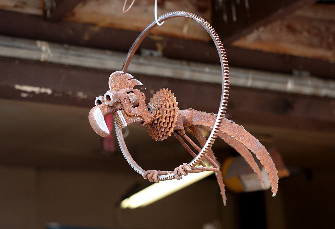 A bird sculpture is suspended in Wayne Hill&#146;s workshop where he welds found metal pieces into sculptures. (Mackenzie Reiss/Daily Inter Lake)