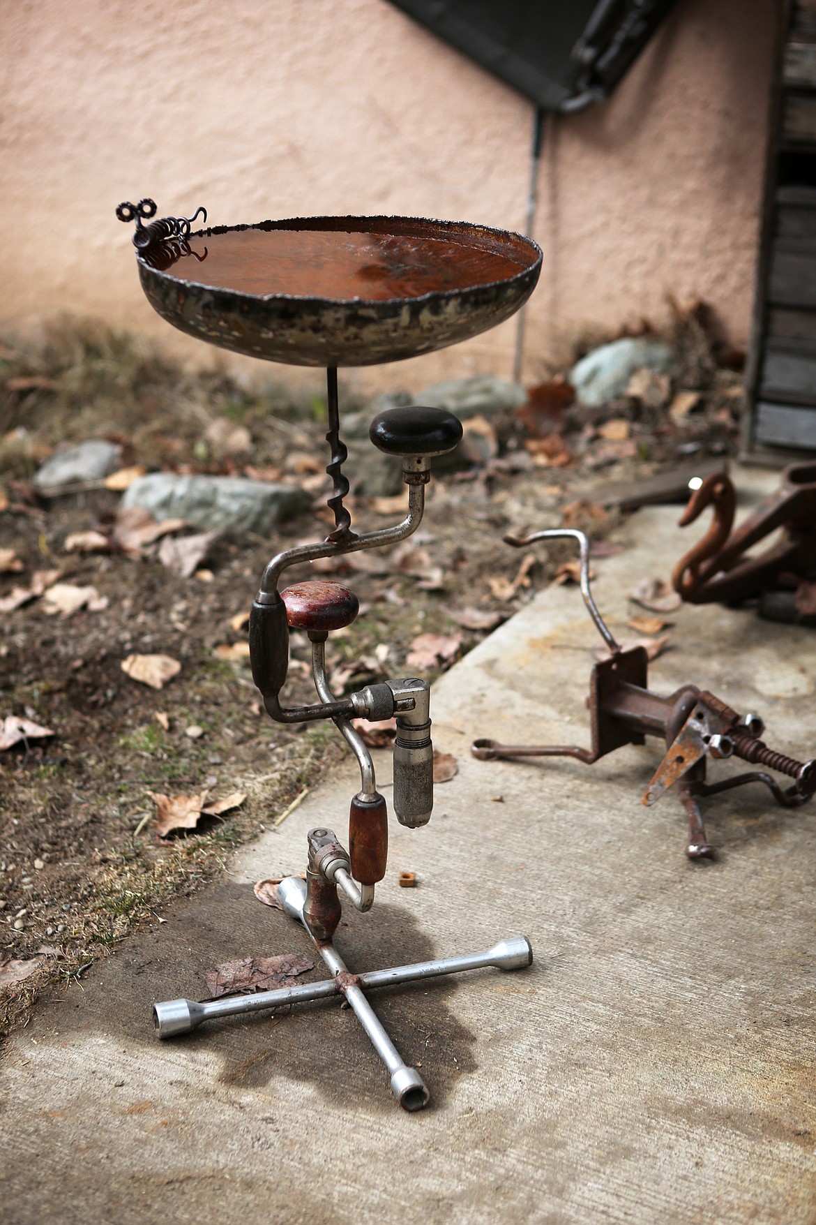 A bird bath made of tools and scrap metal is pictured at Wayne Hill&#146;s Evergreen home. (Mackenzie Reiss/Daily Inter Lake)