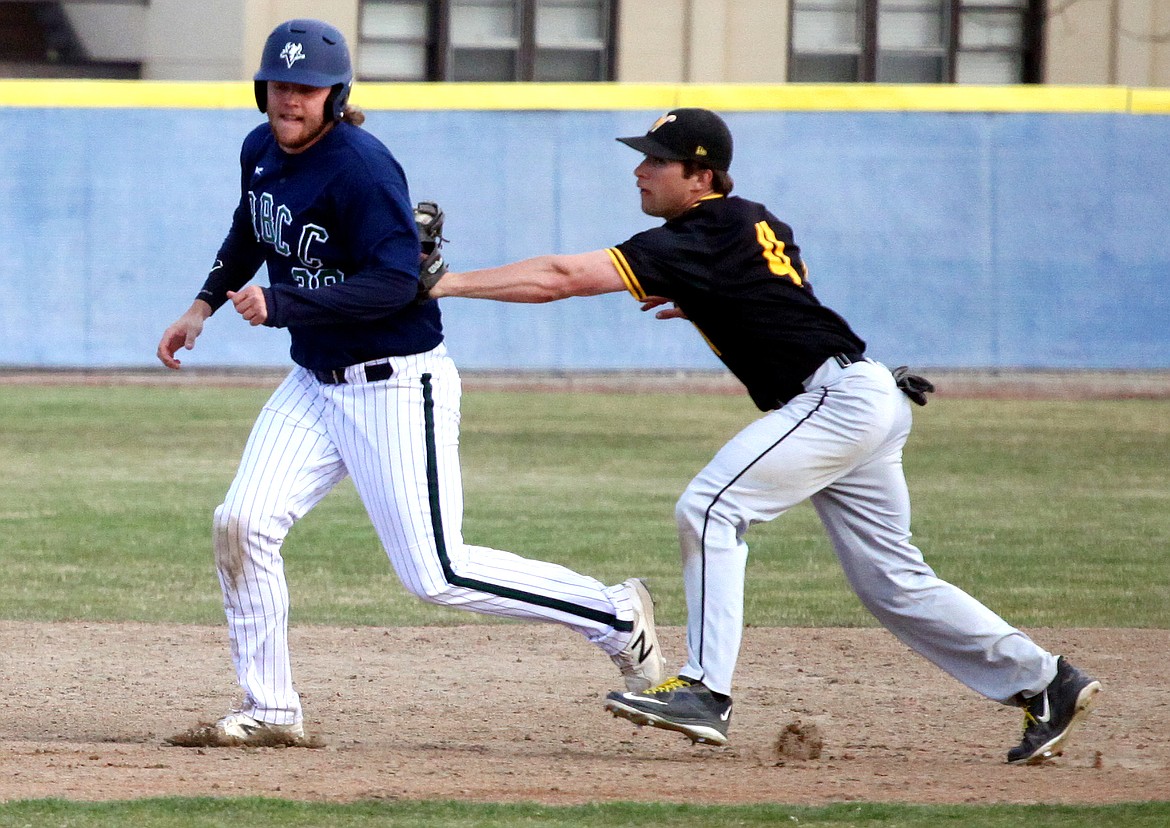 Rodney Harwood/Columbia Basin HeraldWalla Walla second baseman Brian O'Rourke (4) tags out Big Bend runner Nic Metcalf (38) during a rundown in the second game of Wednesday's NWAC East doubleheader at Viking Field.