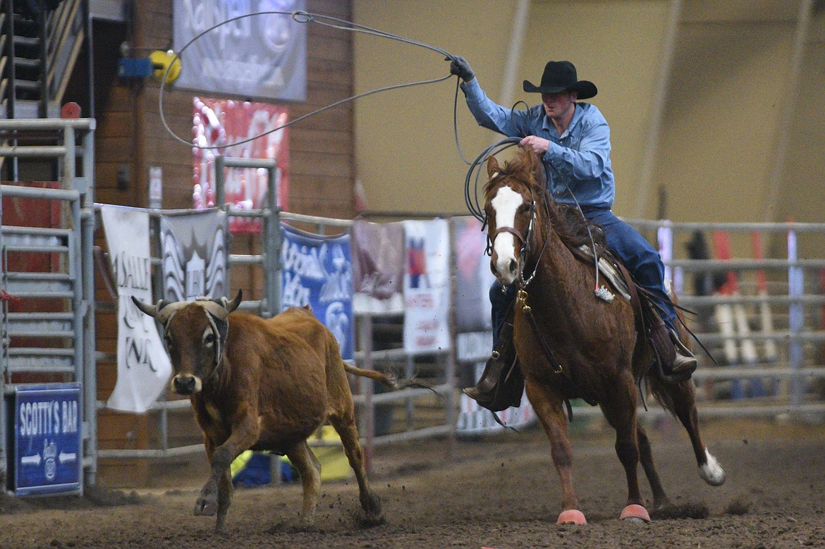 Owen Gustafson and teammate Levi McClure, not shown, compete in the team roping event at the Montana High School Rodeo Association 2018 at Majestic Valley Arena in Kalispell on Friday. (Casey Kreider/Daily Inter Lake)