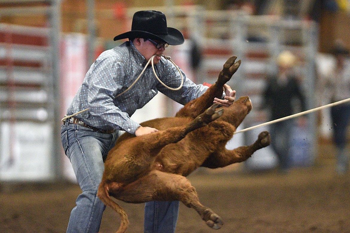 Taylen Lytle, of Cut Bank, ropes a calf in the tie down event at the Montana High School Rodeo Association 2018 at Majestic Valley Arena in Kalispell on Friday. (Casey Kreider/Daily Inter Lake)