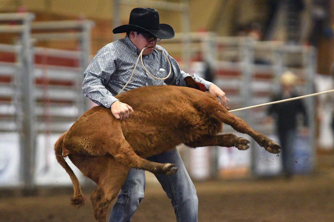 Taylen Lytle, of Cut Bank, ropes a calf in the tie down event at the Montana High School Rodeo Association 2018 at Majestic Valley Arena in Kalispell on Friday. (Casey Kreider/Daily Inter Lake)