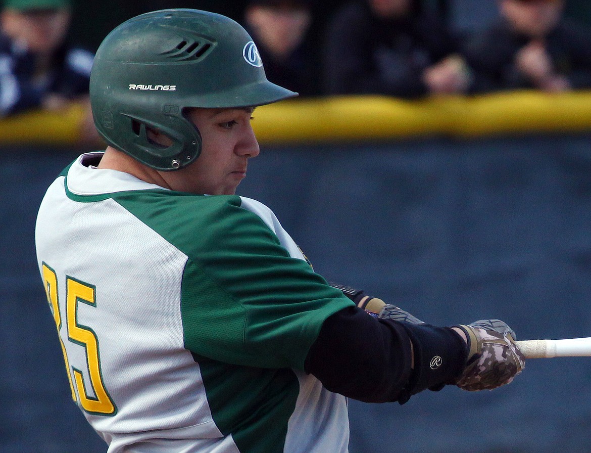 Rodney Harwood/Columbia Basin HeraldQuincy centerfielder Nathan Delgado (35) hits a double in the second inning of the late game during Saturday's CWAC doubleheader against Othello.