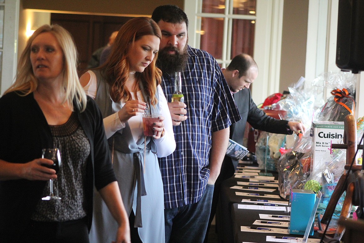 Richard Byrd/Columbia Basin Herald
The items were many to bid on during the Moses Lake Chamber of Commerce&#146;s &#145;Denim and Diamonds&#146; fundraiser Friday night.