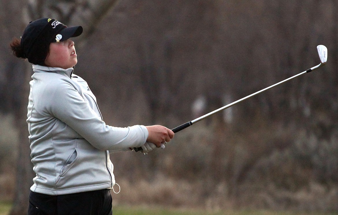 Rodney Harwood/Columbia Basin HeraldEphrata senior Kenedee Peters follows her approach shot into the 14th green on Thursday at the Lakeview Golf &amp; Country Club.