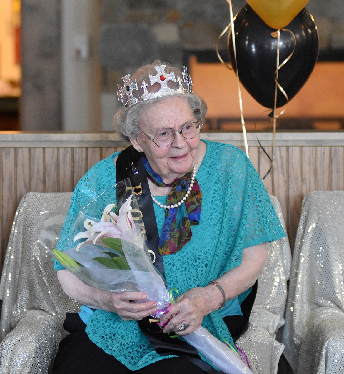 Dicky Adkison takes a seat after being named Prom Queen during the Senior Prom Wednesday evening at The Springs at Whitefish.