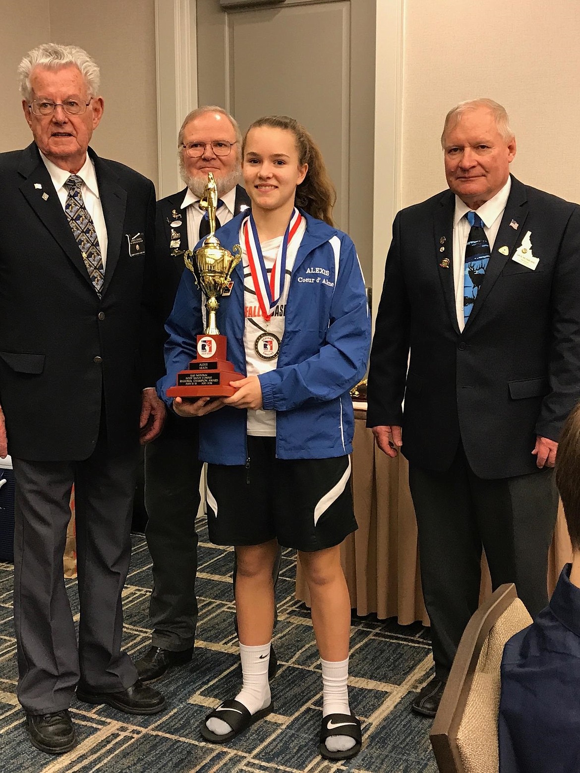 Courtesy photo
River City Middle School&#146;s Alexis Heath earned a spot in the Elks&#146; National Hoop Shoot Championships when she won the girls&#146; 12-13 age group at the Northwest Regional Championships in Vancouver, Wash., on March 10.  Heath beat the state champions from Oregon, Washington and Alaska to advance.  It was Heath&#146;s third trip to regionals and her first win.  Pictured with Heath are, from left, past National Elks President James Damon, Idaho Hoop Shoot Director Harley Birchmier and Idaho State Elks Association President Dave McFarland. Heath will be representing the Coeur d&#146;Alene Elks Lodge at the national championships, which will be held in Chicago on April 21 at Loyola University.