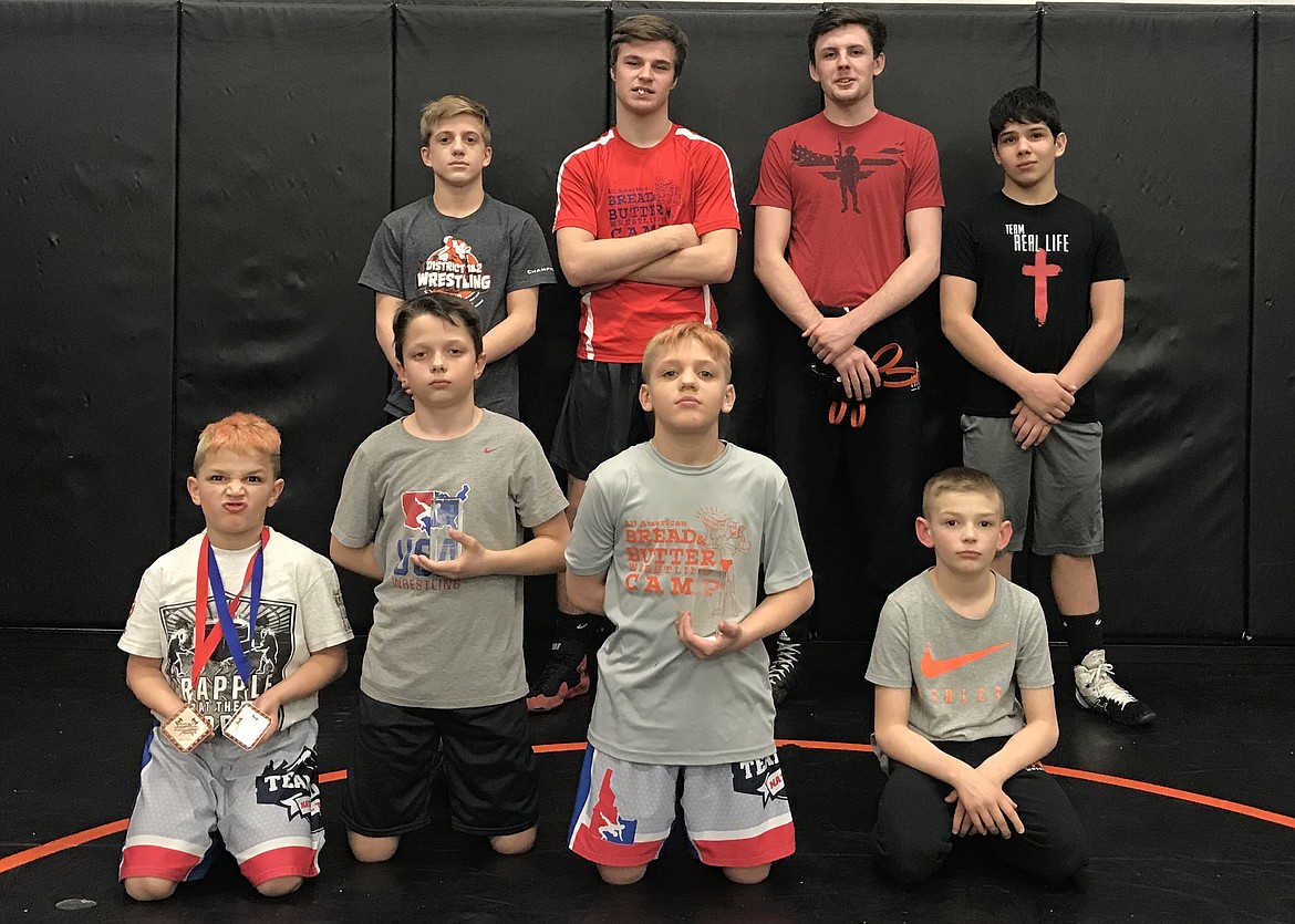 Courtesy photo
Team Real Life wrestlers traveled to Pocatello on March 9-10 to join over 875 wrestlers from mainly Idaho, Utah and Wyoming to participate in the Intermountain Warrior wrestling tournament as well as the Challenge Duals. In the front row from left are Matthew Hamilton, who double bracketed placing 5th and 4th; Byson Huber, 2nd; Damian Hamilton, 2nd and Rider Seguine, 2nd; and back row from left, Roddy Romero, 3rd; Tyler Morris, 5th; Wyatt Shelly, 3rd and Isaac Jessen, 6th. Not pictured but placing: Ridge Lovett, 1st; Braydon Huber, 2nd; Gavin Rodriguez, 3rd; Terran Sharbrough, 4th and Ryan Quimby, 4th. The Challenge Duals were held March 9 and featured all-star teams from Idaho, Utah and Wyoming. Team Idaho included Team Real Life wrestlers Ridge Lovett and Braydon Huber. Team Idaho beat Team Utah 36-25 and Team Wyoming 59-6. Lovett and Huber won both of their All-Star matches.