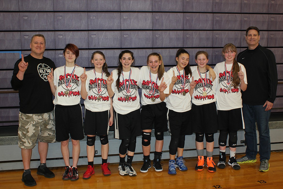 Courtesy photo
The Post Falls Elite Orange eighth-grade AAU girls basketball team won the eighth-grade girls division at the Battle Basketball Tournament last weekend in Lewiston/Clarksto,n going 4-0 for the tournament. From left are coach Bill Owens, Lizzy Owens, Mykah Kirking, Americus Crane, Jadin Krier, Grace Couture-Ishihara, Ashley Grant, Hanna Christensen and coach Craig Christensen.