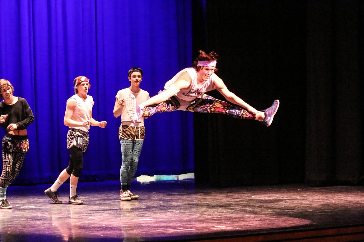 Photo by MANDI BATEMAN
Shayne Walker leaps during the fitness portion of the contest.