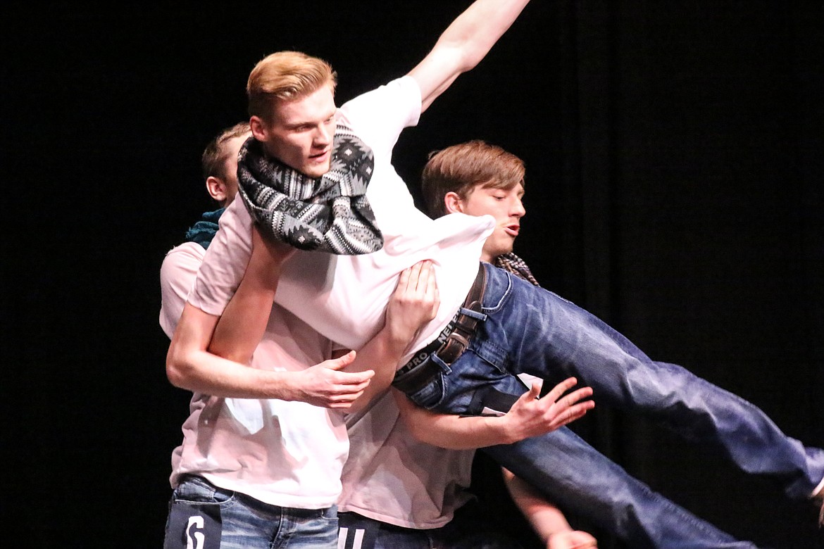 Photo by MANDI BATEMAN
Jesse Sadelin and Zachary Duffens lift Nikolous Bertling during the introduction routine of Mr. BFHS.