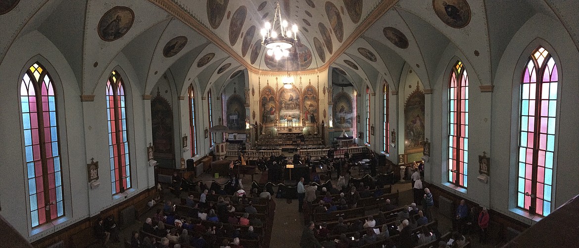 HUNDREDS OF people sit before &#147;Lamb of God&#148; performance by area musicians at the St. Ignatius Mission parish Friday, March 23. (Ashley Fox/Lake County Leader)