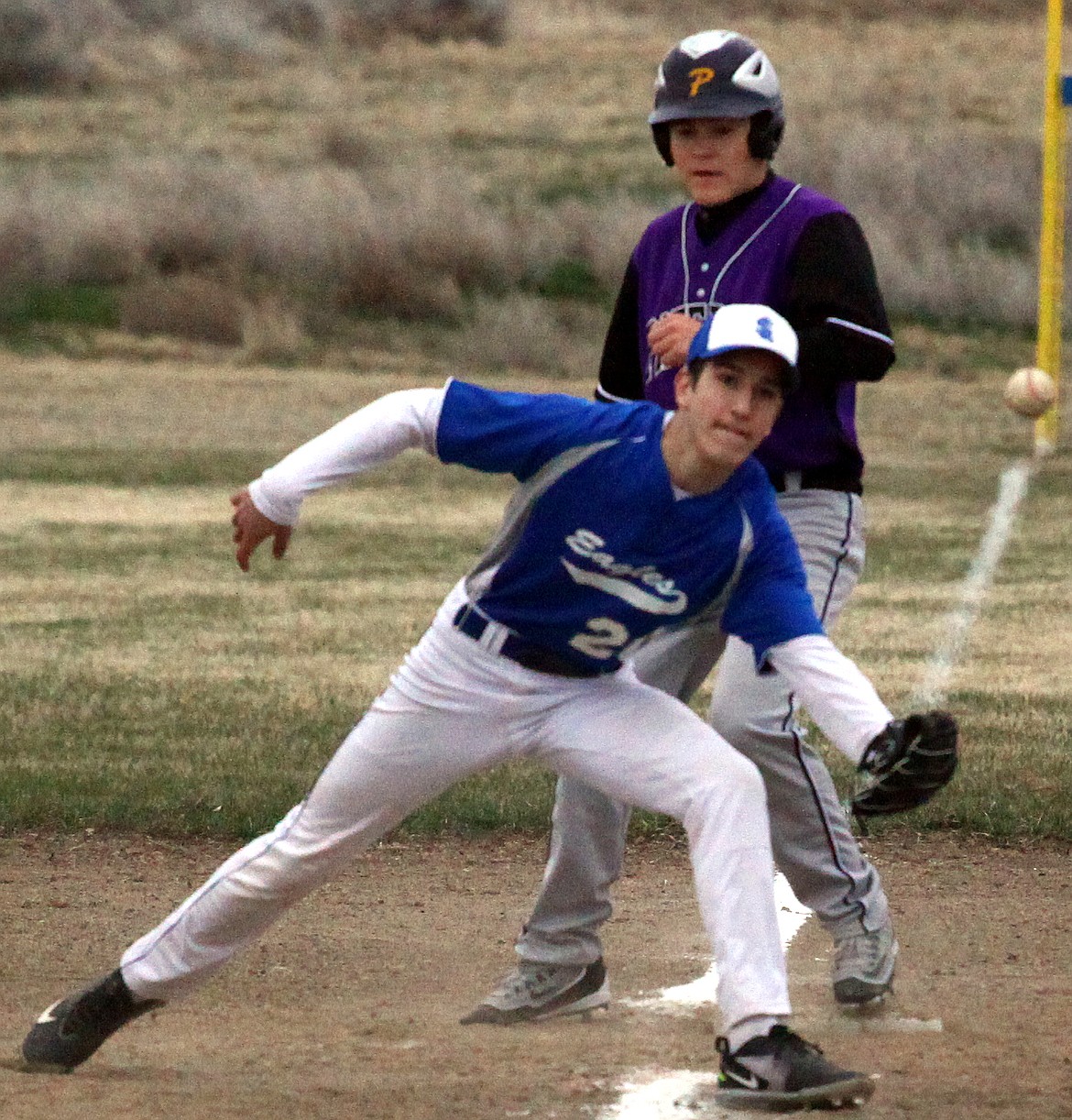 Rodney Harwood/Columbia Basin HeraldSoap Lake third baseman Xhemil Cassedy waits for the throw down to third duing the fourth inning of Wednesday's Central Washington 2B game against Pateros.