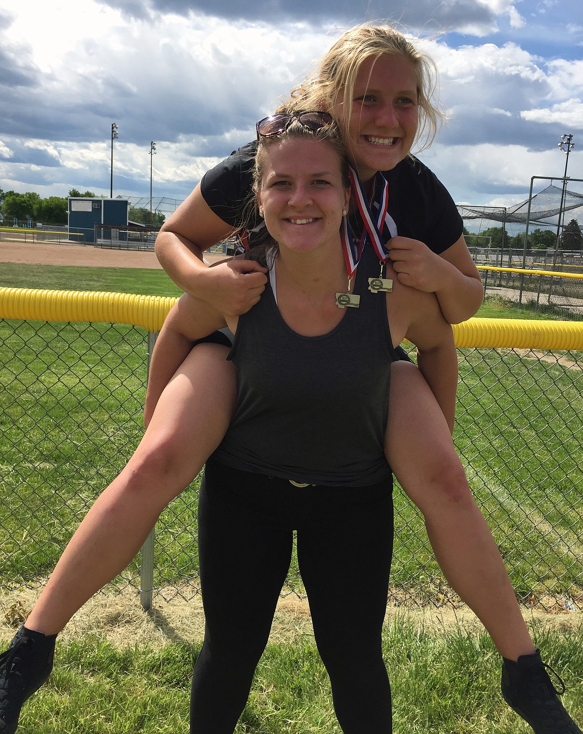 PLAINS HIGH School junior Jessica Thompson, now a two-time MHSA Class C state champion discus and shot put, poses with her sister Leah Thompson, now with Brigham Young&#146;s track team, after her performance in the Class A &amp; C state track meet Friday and Saturday at the Laurel Sports Complex in Laurel High School. Thompson, now a senior, hopes to win back-to-back MHSA Class C state titles entering the 2018 season. (photo courtesy of Denise Montgomery)