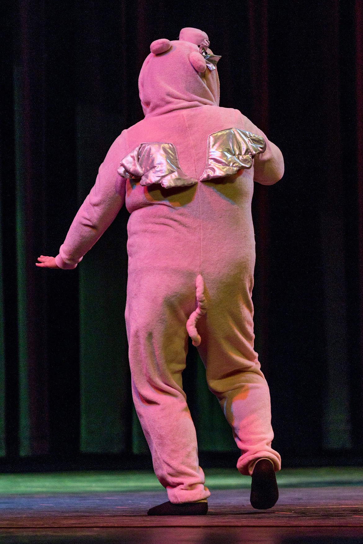 Kristel Donahue performs &#147;Despacito&#148; by Louis Fonsi and Justin Bieber while wearing a pig costume. (John Blodgett/The Western News)