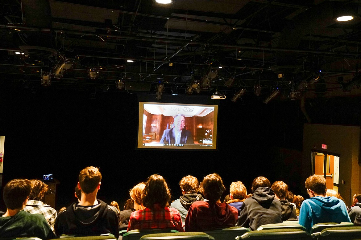 Sitting in the Whitefish High School Black Box Theater students last week listen to Gov. Steve Bullock via Skype during a virtual town hall.